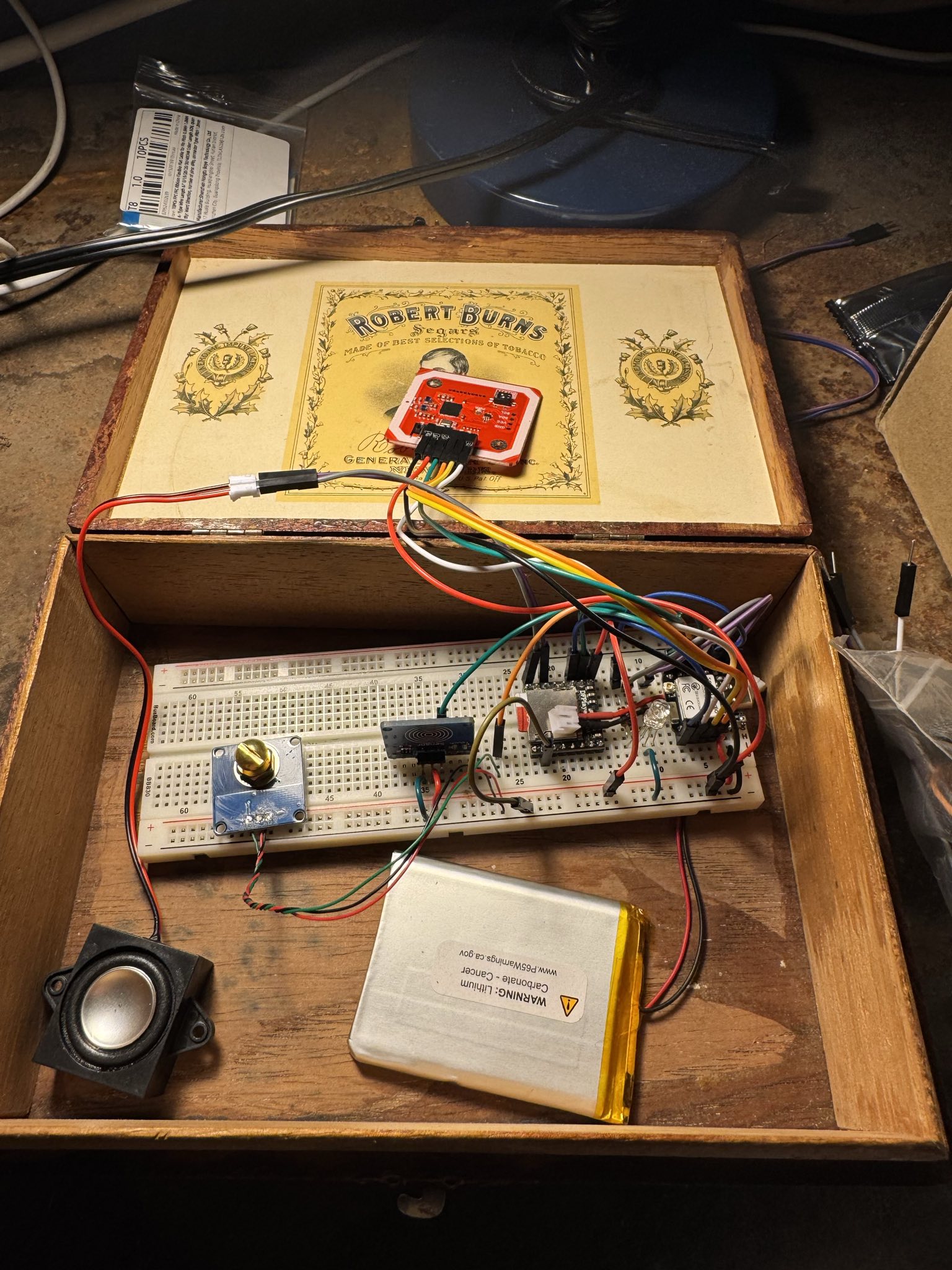 An iteration of the breadboard with all the components! Also, the wooden cigar box I’m aiming to fit everything into.